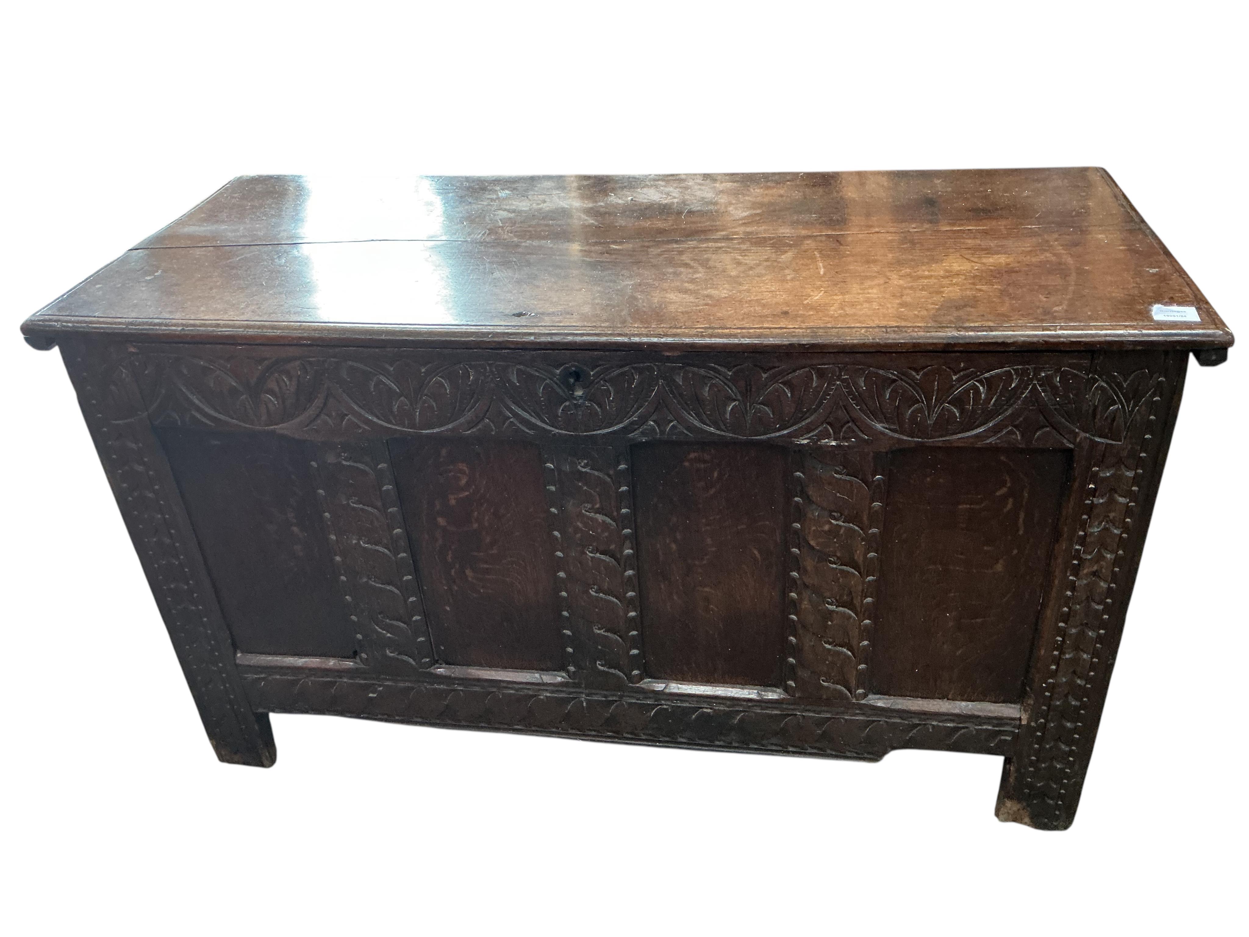 A 17th century carved oak coffer, width 126cm, depth 53cm, height 72cm
